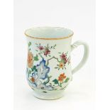 Two Chinese graduated porcelain mugs each painted with crabs within a fence and flowers and fruit,