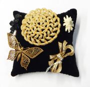 Five 20th century costume brooches including Edelweiss
