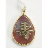 Chinese gold-coloured and hardstone pendant,