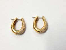 Pair 18ct gold and diamond earrings, each oval hoop,