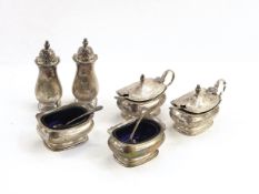 Silver six-piece condiment set comprising a pair of mustard pots,