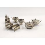 Four-piece silver condiment set, London 1919 (crested), pair of silver half-gadrooned mustard pots,