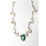 Silver necklace by Fiona Greenwood with central green hardstone pendant flanked by three serpents