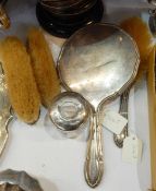 Silver-mounted dressing table set of four pieces viz:- hand mirror, pair of clothes brushes,