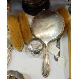 Silver-mounted dressing table set of four pieces viz:- hand mirror, pair of clothes brushes,