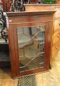 19th century mahogany corner cabinet with dentil cornice, astragal-glazed door with three shelves,