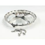 Silver plated serving dish of circular form with glass base and central divider,