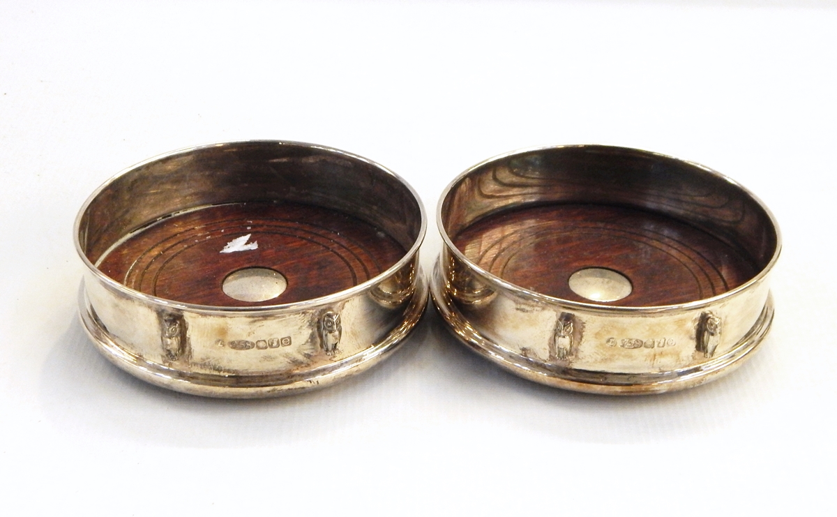 Pair of modern Britannia standard silver wine coasters by Francis Howard Limited,