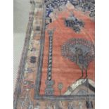 A very fine Turkoman rug with pheasant detail on an orange field within temple border,