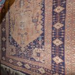 A hand knotted Persian rug the beige gro