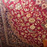 A Persian Keshan style carpet the rouge