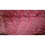 A Persian Bokhara style carpet the red f