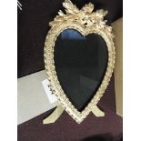 An Edwardian design gilt metal heart shaped photograph frame with stand