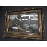 An oil on board rural dwellings in gilt frame indistinctly signed