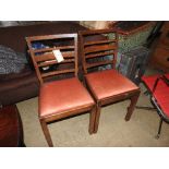 A pair of early 20th century mahogany side chairs, the red upholstered drop in seats over