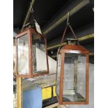 A pair of Georgian design leather clad hanging lanterns with single glazed door - height 50cm