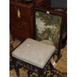 An early 20th Century mahogany firescreen, depicting a tapestry scene of a couple, along with a