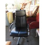 A late 20th century Italian black leather desk chair on a chrome swivel base. 100cm (d) 116 cm (h)