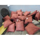 A set of twelve red velour cushions