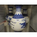 A set of three Oriental vases of bulbous form. 28cm