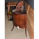 A late 18th/Early 19th Century George III mahogany corner washstand, the cupboard doors over central