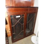 A Victorian style mahogany wall hanging bookcase with twin panel glazed doors