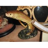 A Beswick style trout on naturalistic setting