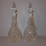 A pair of Stuart crystal glass decanters with stoppers