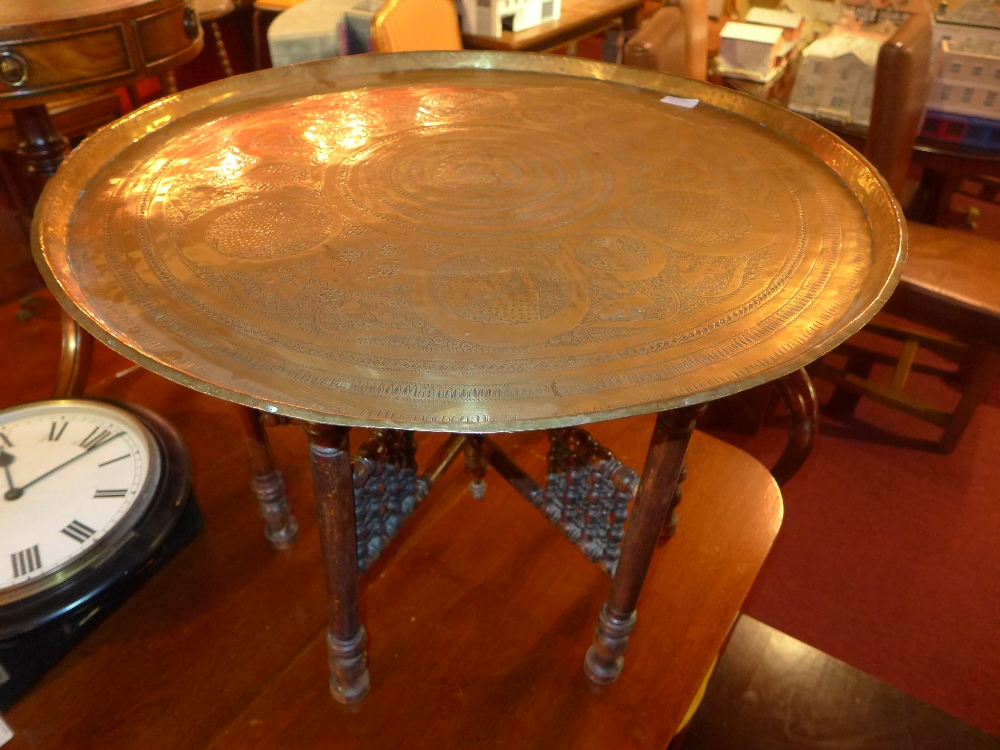 A fusee style railway clock together with an Eastern engraved brass low table raised on turned - Bild 2 aus 2