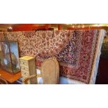 A Persian Keshan style carpet the beige ground having central medallion and floral motifs in a