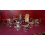 A collection of silver plated tea ware including two tea pots and two cream jugs