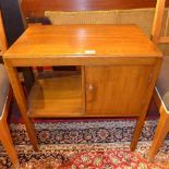 An oak side cabinet fitted single panel door with open recess beside raised on square section