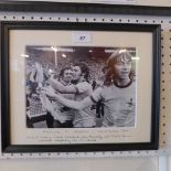 A framed photographic print of Frank Mclintock, Ray Kennedy and Charlie George celebrating the