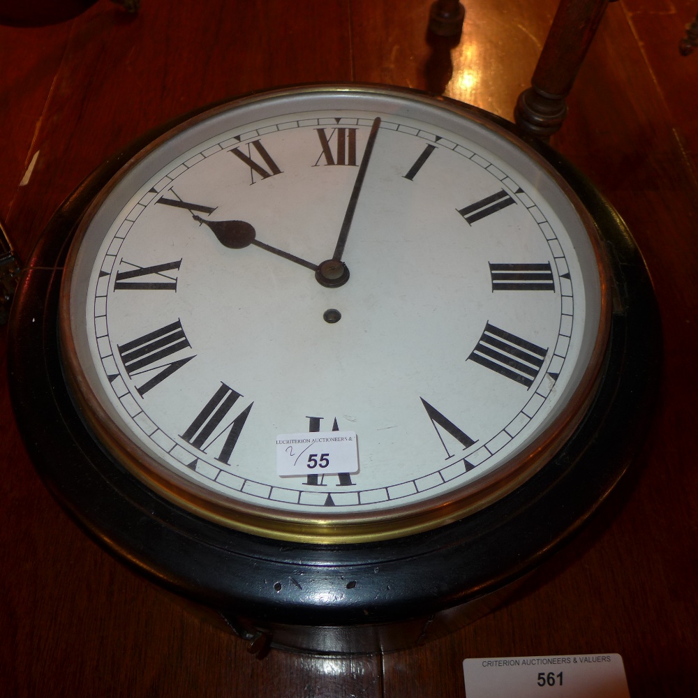 A fusee style railway clock together with an Eastern engraved brass low table raised on turned