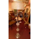 A 1950s floor standing lamp with spherical cut glass detail and chrome stand