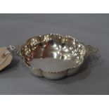 A hallmarked silver quaich with twin pierced ribbon handles, London 1929