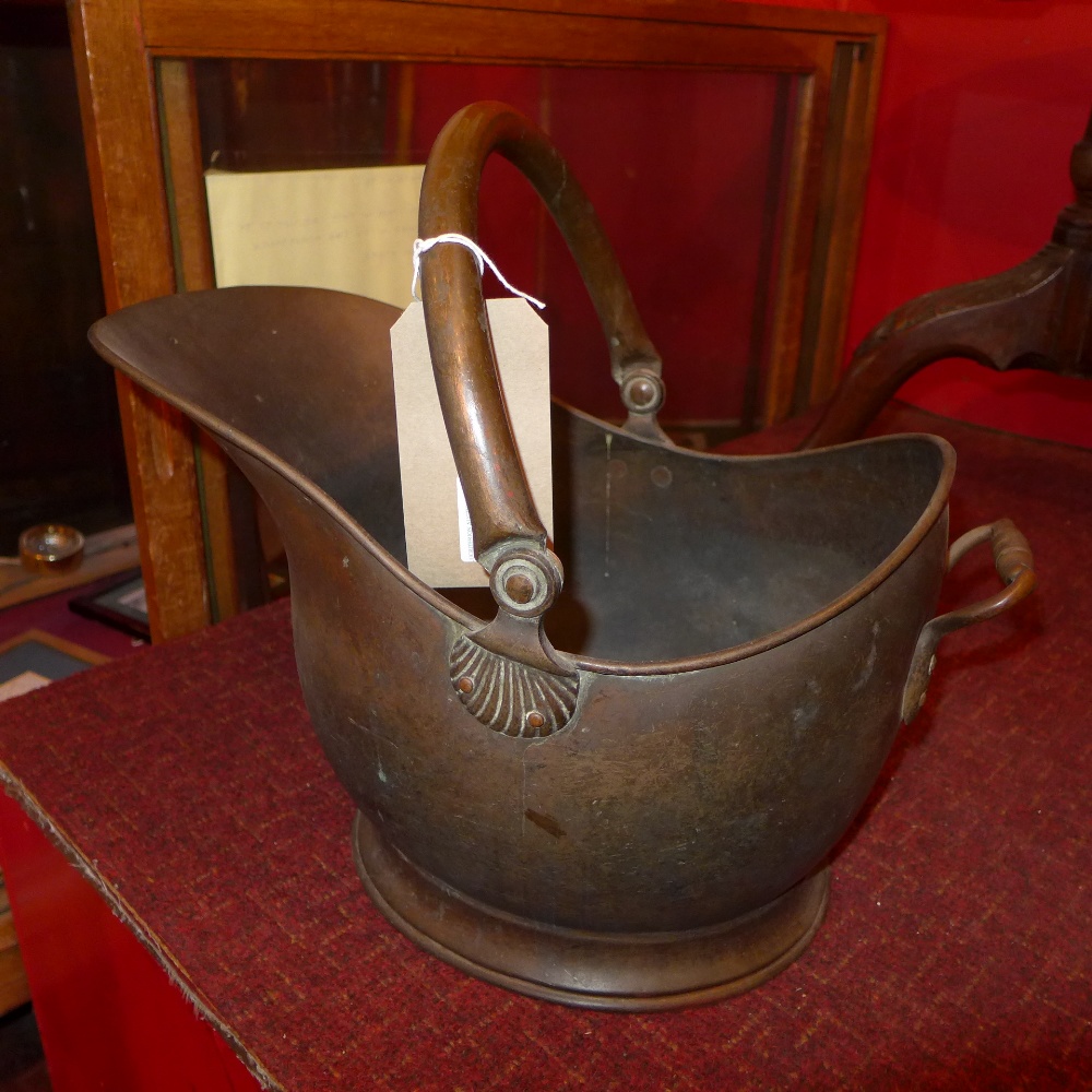 A Victorian brass coal scuttle