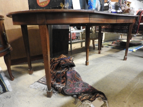 An early 20th century D-end dining table with two extra leaves on square tapered supports 194 cm (L)