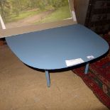 A contemporary blue metal low table of quatreform outline on short supports