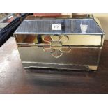 A mirrored glass jewellery casket of rectangular form fitted bevelled segmented plates 25 x 38 x