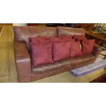 A 20th Century distressed brown leather two seater sofa 210x95x86cm