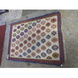 A hand made Persian Kelim rug, the geometric design within blue and red border, 143cm x 104cm.