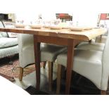 A large cherrywood table with twin flaps raised on tapered supports 76cm x 235cm x 68cm