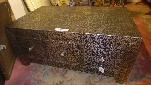 A low metal repousse chest of six square drawers on square feet