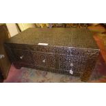 A low metal repousse chest of six square drawers on square feet