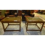 A pair of faux walnut lamp tables having cane and glass inset tops on square tapering supports