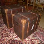 A matched pair of faux crocodile skin upholstered trunks, bound and clad (2)