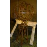 An armillary sphere of large proportions with star decoration.