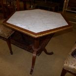 A mahogany hexagonal side table with marble inset with gilt border 75cm x 78cm x 60cm.