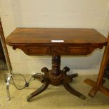An early 19th Century Regency rosewood card table with a green top on a turned faux rosewood